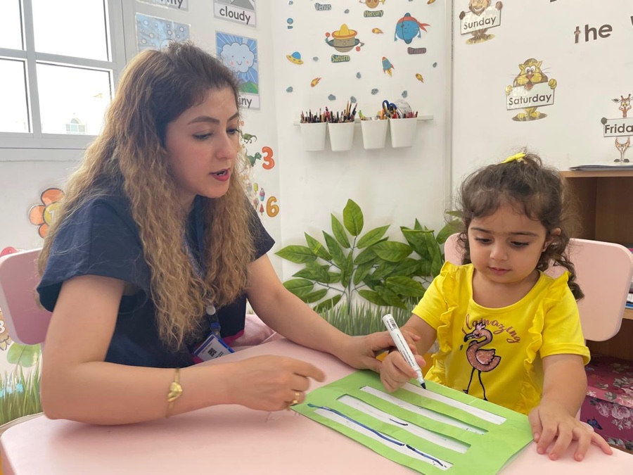 A teacher working one to one with a child