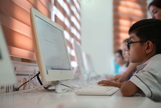 Students working in the ICT room at American Lyceum Muscat